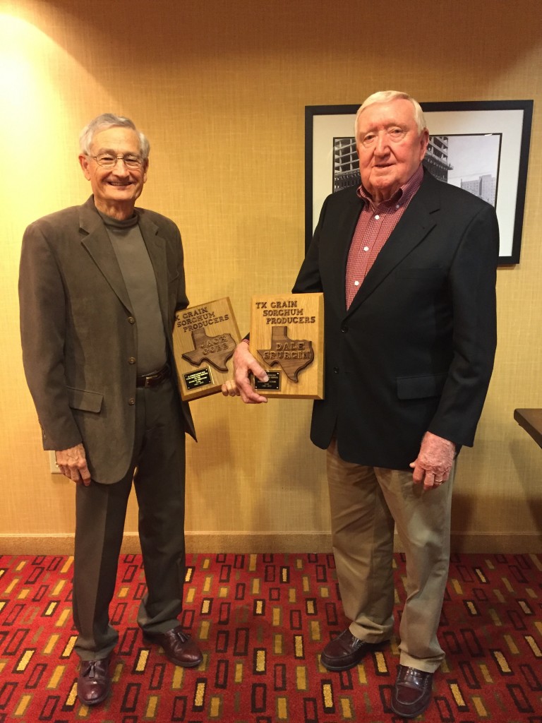 Jack Cobb (left) and Dale Spurgin (right) receive plaques in honor of their service to the sorghum industry at their final Texas Sorghum Board meeting.